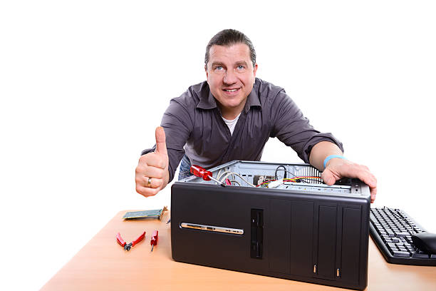 A Man Repairing Computer CPU with a Thumbs Up