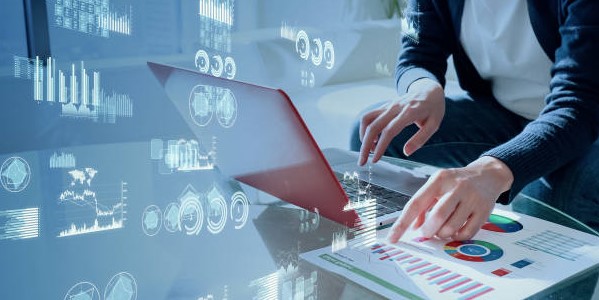 A Man Working on his Laptop with Analytics