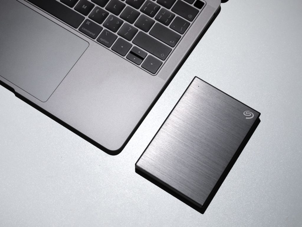 A Laptop and a Hard Drive Storage for Backup
